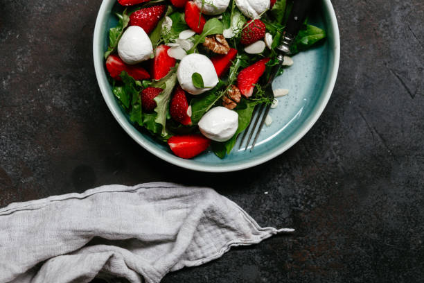 istock Salad with strawberries, mozzarella and arugula 1364384402