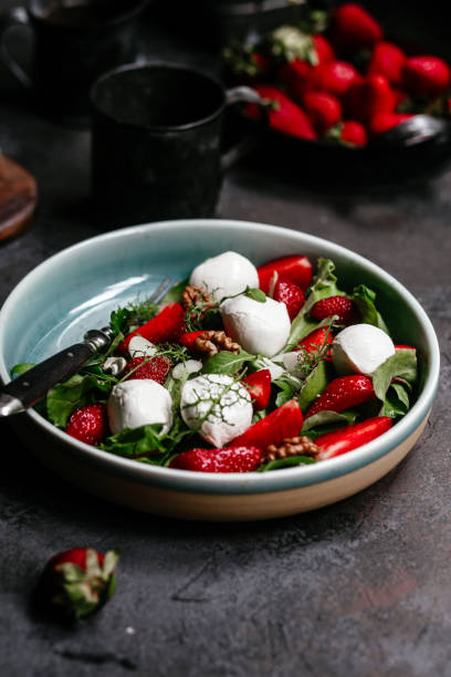 istock Salad with strawberries, mozzarella and arugula 1364384455