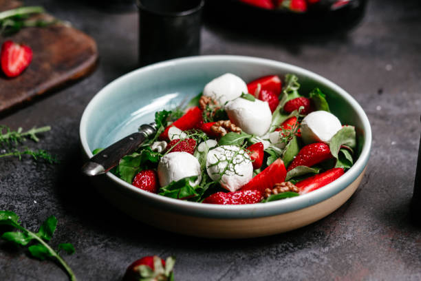 istock Salad with strawberries, mozzarella and arugula 1364384460