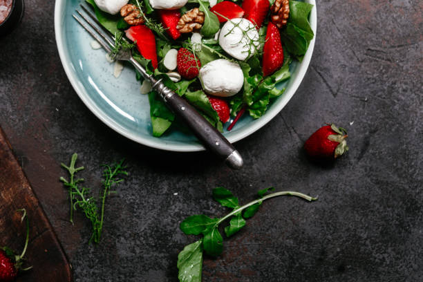 istock Salad with strawberries, mozzarella and arugula 1364384469