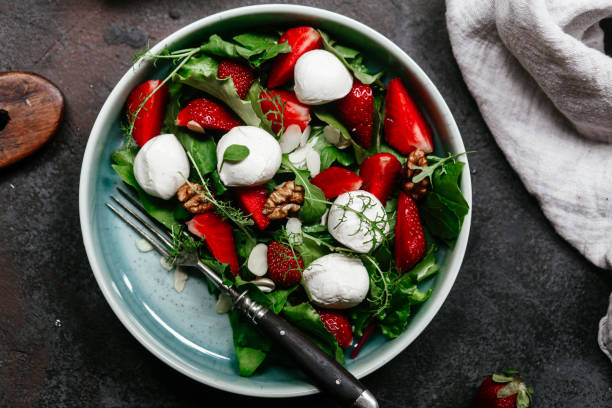 istock Salad with strawberries, mozzarella and arugula 1364384500