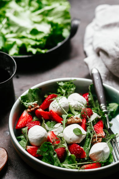 istock Salad with strawberries, mozzarella and arugula 1364384502