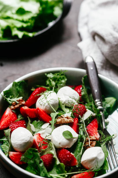 istock Salad with strawberries, mozzarella and arugula 1364384504