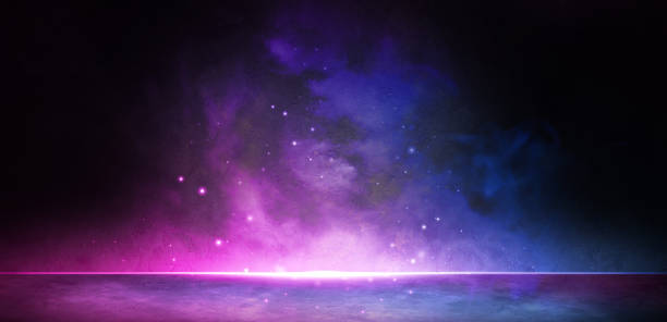 istock Exotic Particle Effects With Smoke And Spotlight In Asphalt Street Captivating Lighting with Midnight Blue Colors Spotlight Background Lighting Concept For Ads,Header And Banner 1364385559