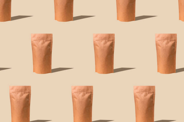 Pouch bag mockup pattern beige background monochrome. Merchandise packaging. Blank brown kraft paper pack demonstration.