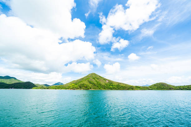 istock Green island under blue sky in sunny day 1364386394