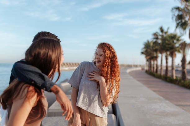 istock Friends sharing a hilarious moment on the promenade 1364387753