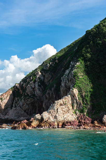 istock Green island under blue sky in sunny day 1364388087