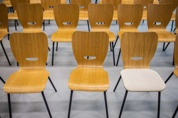 istock Empty  wooden chairs in the row 1364388574