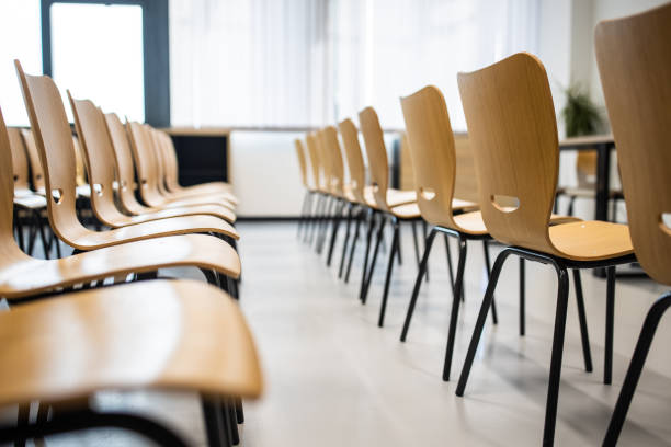 istock Wooden chairs in the row 1364388602
