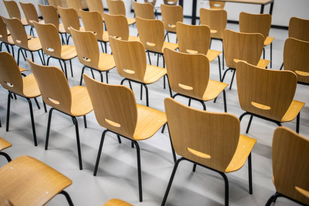 istock Rows of wooden chairs 1364388640