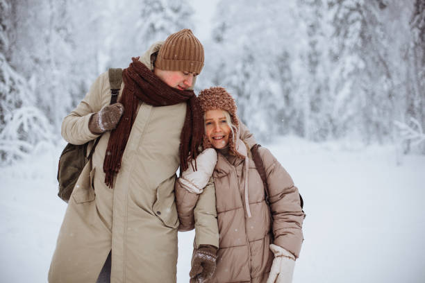 istock Couple in love walks through the winter forest 1364389196