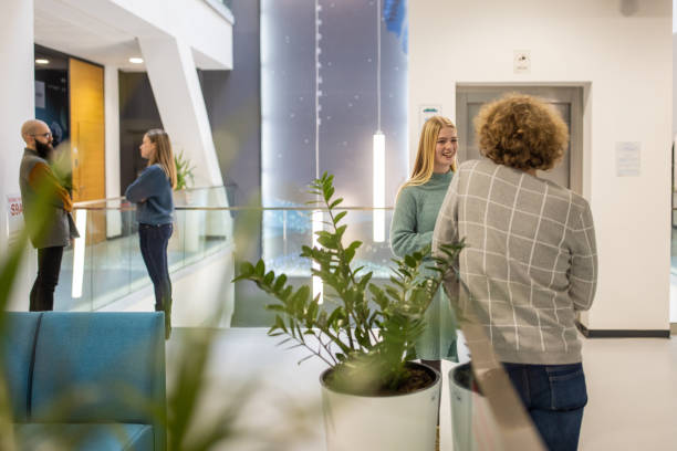 istock At the modern office, young Caucasian colleagues talking 1364389294