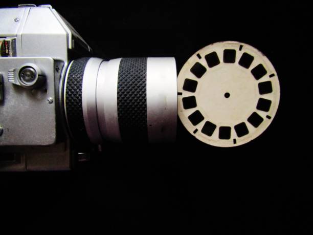 istock Old Movie camera with film reel 1364391375