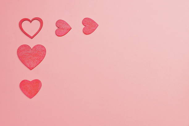 istock Hearts on pink background, love romantic card 1364391401