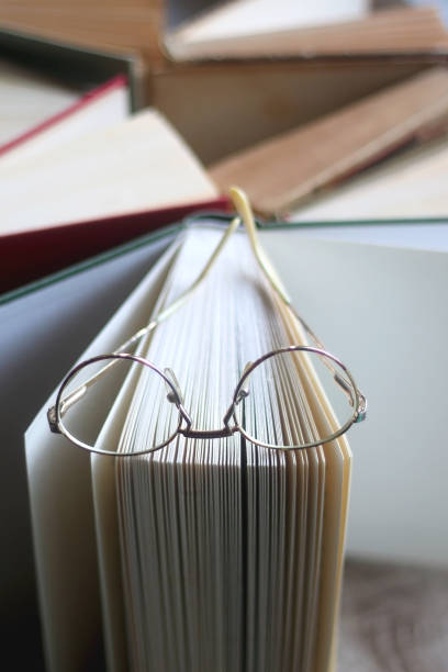 Hardcover Books and Reading Glasses