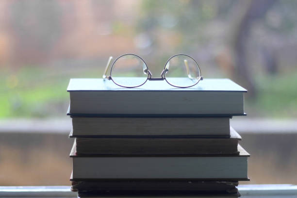 istock Hardcover Books and Reading Glasses 1364392358