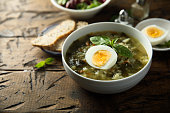 Green soup with eggs