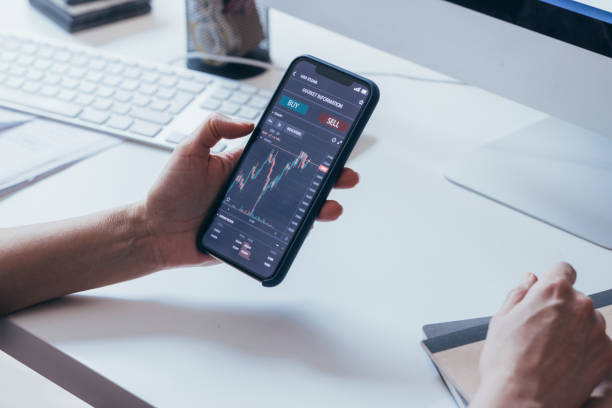 istock An Unrecognizable Caucasian Male Using His Smartphone To Check The Market Information Chart 1364393604