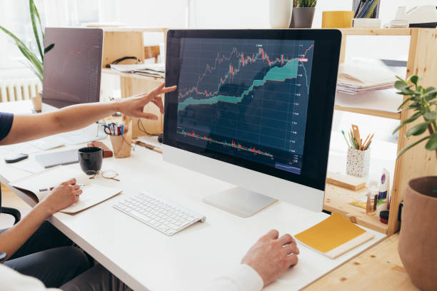 istock Unrecognizable People Talking About Some Statistics Being Displayed  On The Screen Of Their Computer 1364393700