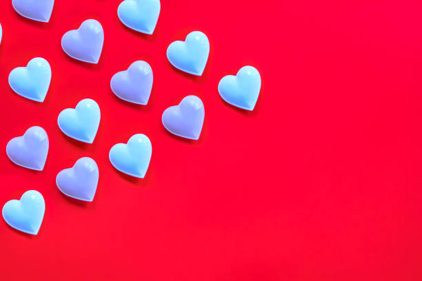 istock Valentine's day card, pattern. White and light pink hearts on red. Isometric 1364394104