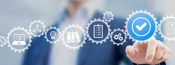 istock Quality management with QA (assurance), QC (control) and improvement. Standardisation and certification concept. Compliance to regulations and standards. Concept with manager or auditor. 1364394148