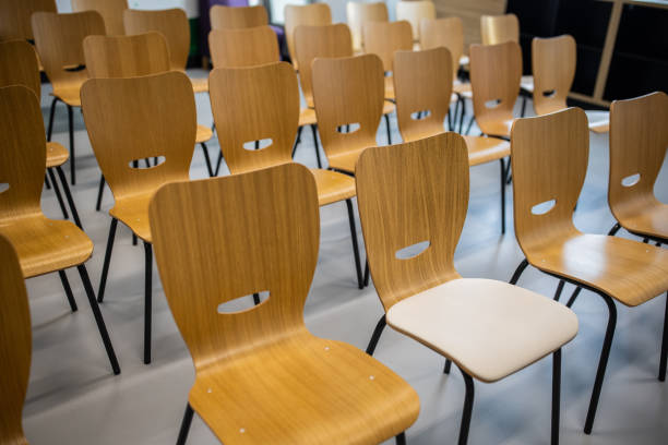 istock Empty wooden chairs in the few rows 1364395014