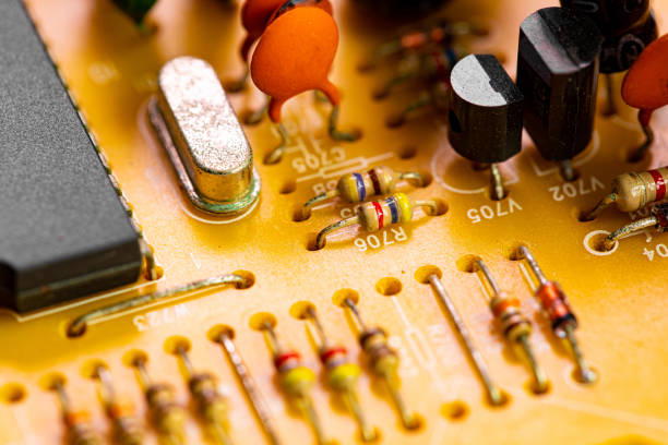 istock Close up of components and microchips on old PC circuit board 1364395345