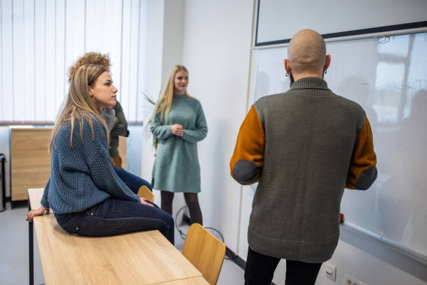 istock Caucasian University students brainstorming the assignment together at the classroom 1364395430