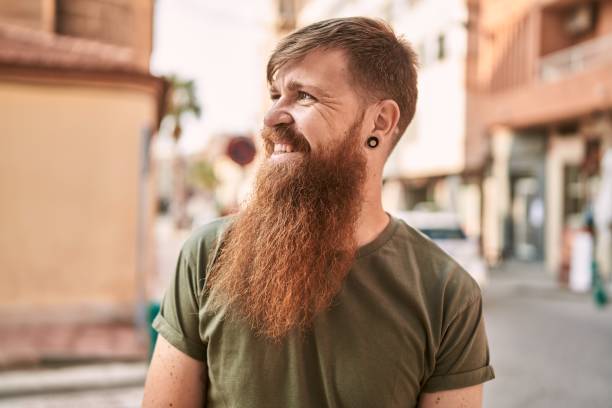 istock Young redhead man smiling confident standing at street 1364397127