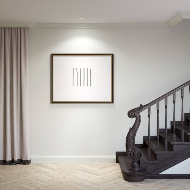 istock Entrance hallway in light colors with illuminated horizontal poster between the classic dark wood staircase and beige curtains, light parquet floor, ceiling with built-in spotlights. 1364397857