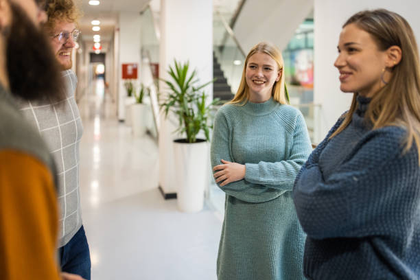 istock Serene students talking at the hall of the University 1364398038