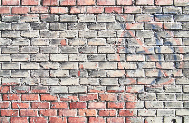 istock Brick wall texture with cracked tiles and cement. Classic brickwall surface background 1364399908