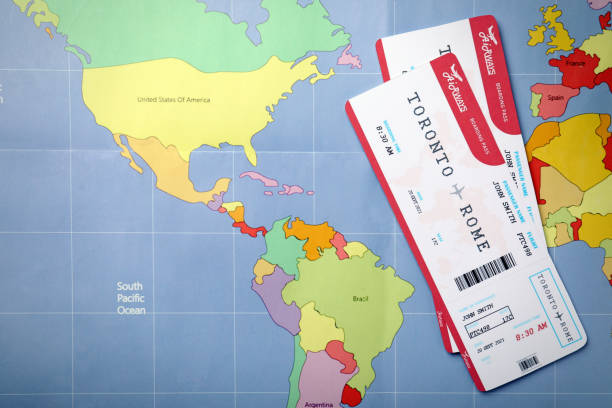 istock Tickets on world map, flat lay. Travel agency concept 1364401999