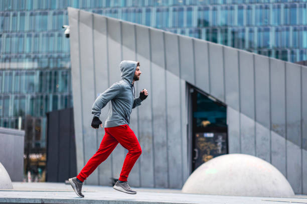 istock Young man running in the city 1364405542