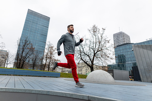 Young man running in the city