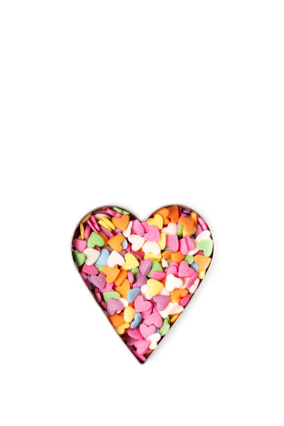 istock Multi-colored heart-shaped sprinkles pastry topping in heart form, minimalistic saint valentine`s day greeting card 1364406512