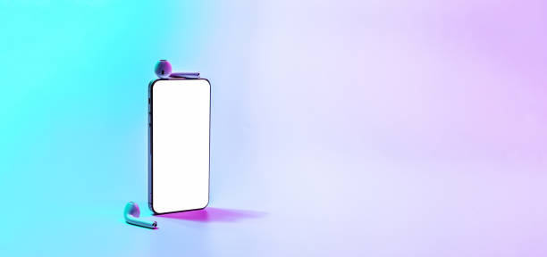 istock Screen mockup. Mobile smartphone technology blank screen. Mock up smart phone device, audio headphones on neon gradient banner. Game design, mobile application presentation or portfolio mockups. 1364408868