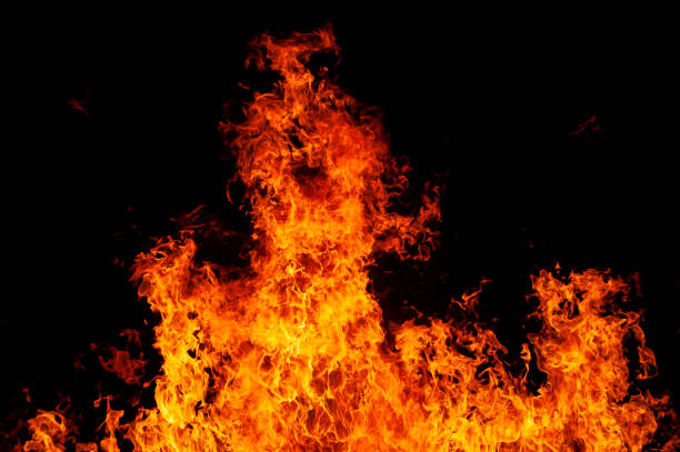 istock Flames rise in the night fire 1364410215