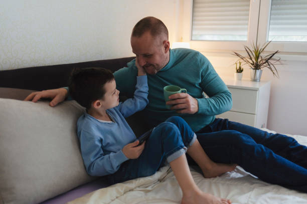 istock Father and son together at home. 1364411267