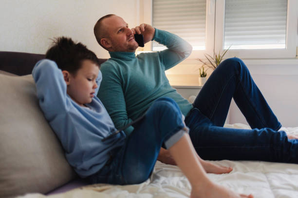 istock Father and son with smartphone. 1364411985