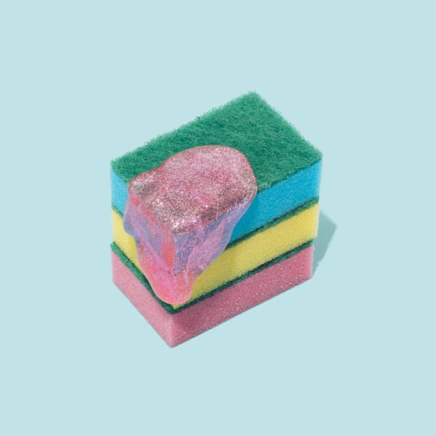 istock Various sponges symbolizing a cake with slime on a pastel blue background. 1364412170