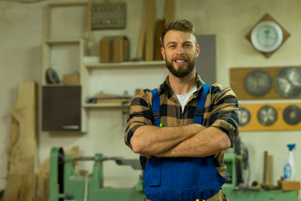 istock Portrait of smiley handsome carpenter at his workplace 1364412495