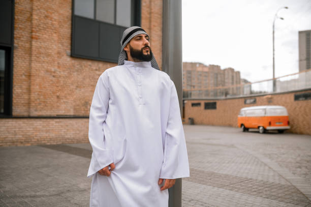 istock Middle eastern bearded man in traditional white clothing 1364413616