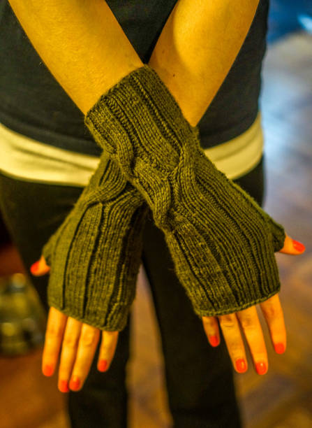 istock Wearing knit fingerless gloves 1364417760