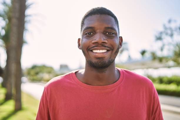 istock Young african man smiling confident at park 1364418582