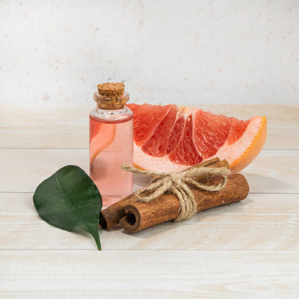 istock Bottle of grapefruit essential oil and cinnamon. Aromatherapy. Alternative medicine 1364420618