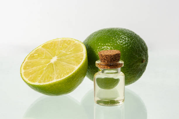 istock Lime essential oil and whole lime. Aromatherapy. Isolated 1364420674