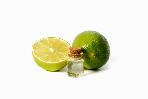 istock Lime essential oil and whole lime. Aromatherapy. Isolated 1364420710