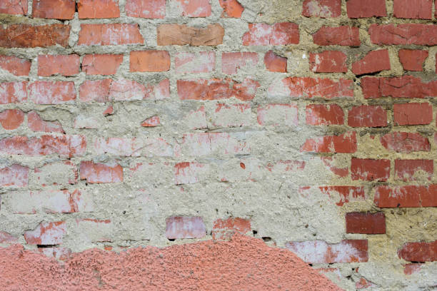 istock Red White Vintage Brick Painted Wall With Damaged Plaster 1364420788